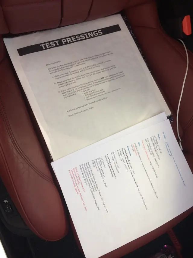Editorial: one of the first cuts in a white sleeve and the draft of the back cover texts.